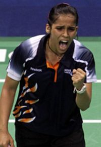 Home favourite: Saina Nehwal celebrates after defeating Wong Mew Choo in the women&rsquo;s singles final Thursday.