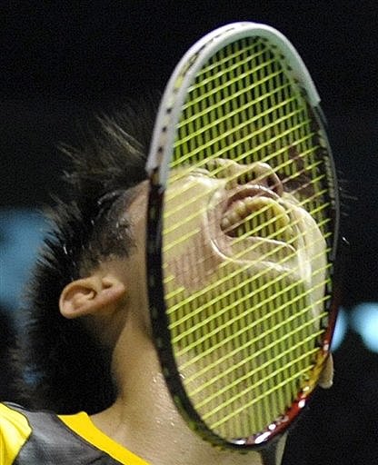 China's Lin Dan celebrates after defeating South Korea's Park Sung Hwan during the men's singles final match
