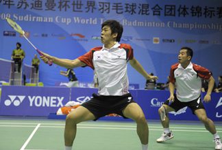 South Korea's Lee Yong Dae (left) and Jung Jae Sung (right) competes in the men's doubles preliminary match against Malaysia's Koo Kean Keat and Tan Boon Heong.