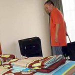 Room for improvement: Malaysia&rsquo;s new singles coach Hendrawan checking into his room at the hostel in Mount Kiara Monday.