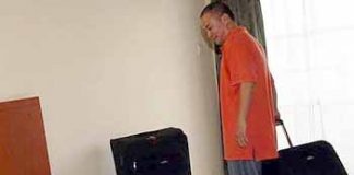 Room for improvement: Malaysia&rsquo;s new singles coach Hendrawan checking into his room at the hostel in Mount Kiara Monday.