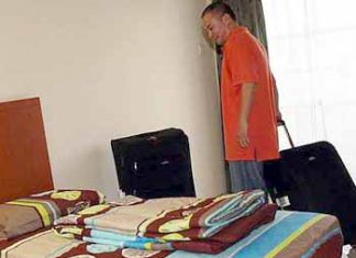 Room for improvement: Malaysia&rsquo;s new singles coach Hendrawan checking into his room at the hostel in Mount Kiara Monday.