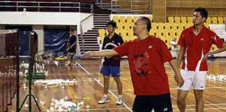 Hands-on coach: Hendrawan teaching Mohd Hafiz Hashim (right) how to return a net shot during training yesterday.