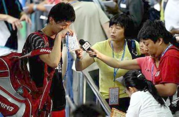Early exit: A dejected Bao Chunlai talking to the Chinese press after losing his first-round match to Holland's Dicky Palyama Monday.