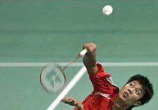 Safely through: Thailand&rsquo;s Boonsak Ponsana using his Kumpoo racquet to return a shot to Lithuania&rsquo;s Kestutis Navickas yesterday. Boonsak won 21-14, 14-21, 21-17