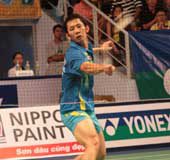 Bird man: Nguyen Tien Minh returns a drop shot from his Malaysian opponent Chong Wei Feng in the men's singles final yesterday. Minh won 21-7, 19-21, 21-14 to clinch the second title in succession.