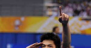 Lin Dan of the People's Liberation Army (PLA) team celebrates after winning the men's singles final of badminton against Bao Chunlai of Hunan province at the 11th Chinese National Games in Jinan, east China's Shandong Province, Oct. 18, 2009. Lin won the match 2-0 and claimed the title of the event.
