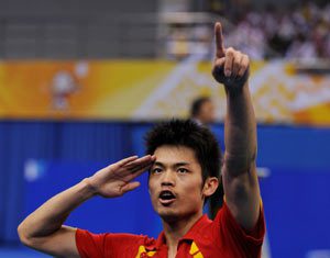 Lin Dan of the People's Liberation Army (PLA) team celebrates after winning the men's singles final of badminton against Bao Chunlai of Hunan province at the 11th Chinese National Games in Jinan, east China's Shandong Province, Oct. 18, 2009. Lin won the match 2-0 and claimed the title of the event.