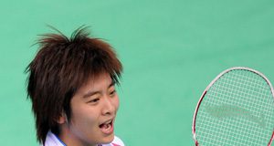 Wang Lin of Zhejiang province jubilates after the women's singles final of badminton against Wang Shixian of Jiangsu province at the 11th Chinese National Games in Jinan, east China's Shandong Province, Oct. 17, 2009. Wang won the match 2-1 and claimed the title of the event.