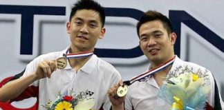Malaysia's Koo Kien Keat and Tan Boon Heong with the winning mock cheque after beating China's Guo Zhengdong and Xu Chen in the Malaysian Open Badminton Final at Putra stadium in Bukit Jalil Sunday. The Malaysian pair won 21-15 17-21 21-16.