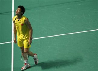 China's Lin Dan reacts after losing a point to South Korea's Choi Ho-jin during the men's badminton singles final match at the East Asian Games in Hong Kong December 13, 2009.