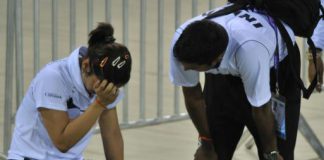 TOO HARD TO DIGEST: Saina nehwal breaks down after losing in the semifinals of the badminton Asia Championship in New Delhi. At right is coach Gopi Chand.