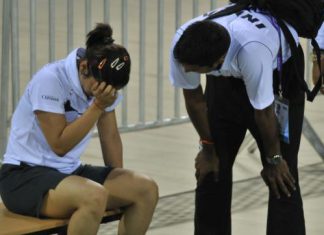 TOO HARD TO DIGEST: Saina nehwal breaks down after losing in the semifinals of the badminton Asia Championship in New Delhi. At right is coach Gopi Chand.