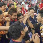 On a high: Mohd Hafiz Hashim being congratulated by Lee Chong Wei and team-mates after he beat Denmark’s Joachim Persson to help Malaysia qualify for the semi-finals of the Thomas Cup.