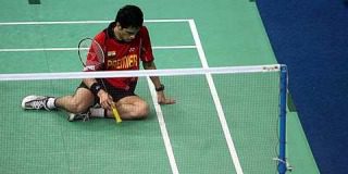 Down and out: Indonesia's Taufik Hidayat (right) celebrates after beating India's Kashyap Parupalli 21-12, 10-21, 21-17 in the first singles yesterday. Indonesia won 3-0 to reach the semi-finals.