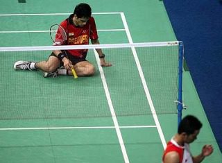 Down and out: Indonesia's Taufik Hidayat (right) celebrates after beating India's Kashyap Parupalli 21-12, 10-21, 21-17 in the first singles yesterday. Indonesia won 3-0 to reach the semi-finals.