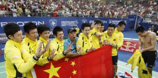 Flagging: Members of the Chinese team pose for a photo with their national flag after they defeated Indonesia in the final of the Thomas Cup badminton championships in Kuala Lumpur on Sunday.