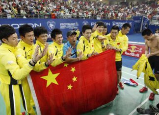 Flagging: Members of the Chinese team pose for a photo with their national flag after they defeated Indonesia in the final of the Thomas Cup badminton championships in Kuala Lumpur on Sunday.