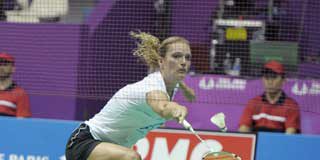Dutch player Tine Baun hits a return to Taipei's Cheng Shao-Chieh during the Women singles quarter finals of the Badminton World Championship