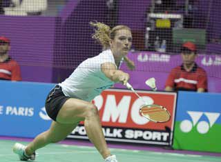 Dutch player Tine Baun hits a return to Taipei's Cheng Shao-Chieh during the Women singles quarter finals of the Badminton World Championship