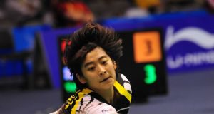 China's Wang Lin returns the shuttle to England's Sarah Walker during the women's singles competition at the 11th Sudirman Cup World Team Badminton Championship in Guangzhou, south China's Guangdong Province, May 10, 2009. Wang won 2-0.