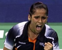 Home favourite: Saina Nehwal celebrates after defeating Wong Mew Choo in the women&rsquo;s singles final Thursday.