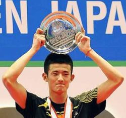 Earning respect: China&rsquo;s Chen Long raising his winning plate on the podium after he won the Japan Open men&rsquo;s singles title by beating Malaysia&rsquo;s Lee Chong Wei 21-8, 10-21, 21-19 in the final on Sunday.
