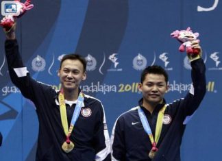 Tony Gunawan (left) and Howard Bach of the United States celebrate winning the gold in the men's doubles badminton event at the Pan American Games in Guadalajara, Mexico.