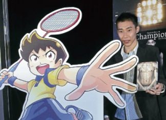 Lee Chong Wei holding a copy of his autobiography &lsquo;Dare to be a Champion&rsquo; beside a cutout of the comic &lsquo;Jejak Libasan Jaguh&rsquo; yesterday. Read more: Chong Wei ready for China backlash - Badminton - New Straits Times http://www.nst.com.my/sports/badminton/chong-wei-ready-for-china-backlash-1.34370#ixzz1jsTeaZ7V