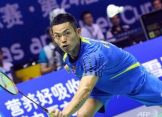 Lin Dan of China returns a shot against Rajiv Ouseph of England during their Group A match at the Thomas Cup world badminton team championships in Hubei province. Superstar Lin was made to sweat in front of an adoring home crowd but China breezed through their first group ties in the tournament.