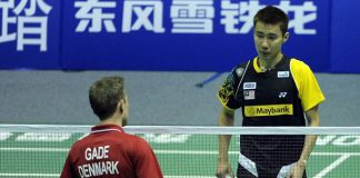 Lee Chong Wei (blue) is forced to retire against Peter Gade in Wuhan