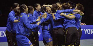 The China team celebrates after defeating South Korea in the final round of the Uber Cup badminton tournament in Wuhan, Hubei province, May 26, 2012.