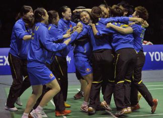 The China team celebrates after defeating South Korea in the final round of the Uber Cup badminton tournament in Wuhan, Hubei province, May 26, 2012.
