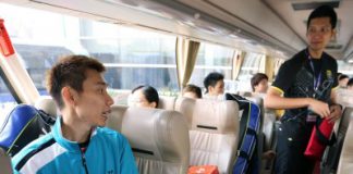 Friendly banter: Lee Chong Wei (left) having a chat with Mohd Hafiz Hashim in the team bus after their training session at the Wuhan Sports Centre Sunday.