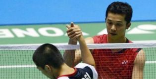 Taufik Hidayat of Indonesia (R) is congratulated by Akira Koga of Japan during their men's singles second round match at the Japan Open badminton championships in Tokyo on September 20, 2012. Hidayat won 21-11, 21-10