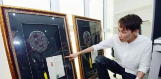 Prized possession: Chong Hoon showing the two badminton racquets that were left behind by the thieves in Chong Wei&rsquo;s office in Bandar Puteri Puchong.