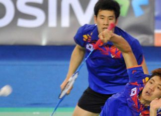 South Korea's Lee Yong-Dae (front) and Ko Sung-Hyun(B) play a shot during their men's doubles badminton match against Mathias Boe and Carsten Mogensen of Denmark during the finals of the Korea Open at Seoul on January 13, 2013.