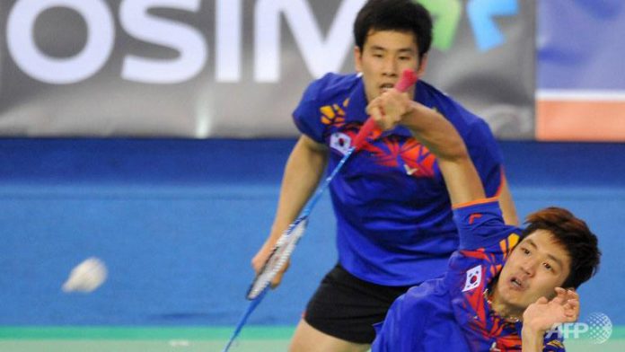 South Korea's Lee Yong-Dae (front) and Ko Sung-Hyun(B) play a shot during their men's doubles badminton match against Mathias Boe and Carsten Mogensen of Denmark during the finals of the Korea Open at Seoul on January 13, 2013. South Korea's Lee Yong-Dae (front) and Ko Sung-Hyun(B) play a shot during their men's doubles badminton match against Mathias Boe and Carsten Mogensen of Denmark during the finals of the Korea Open at Seoul on January 13, 2013.