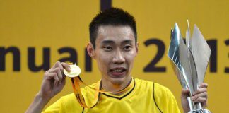 Chong Wei celebrates with his trophy and his gold medal during the awards ceremony after defeating Indonesia's Sony Dwi Kuncoro in the men's single final at the Malaysia Open Badminton Superseries in Kuala Lumpur on Jan 20