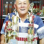 The late Datuk Eddy Choong with some of the many trophies he had won in a stellar career.