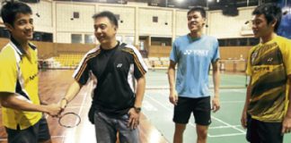 Newly-appointed national doubles coach Paulus Firman (second from left) meets up with some of the players at the training centre in Bukit Kiara yesterday.