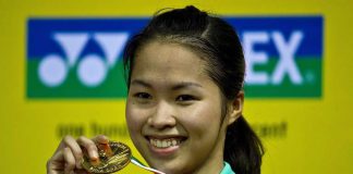 Thailand's Ratchanok Intanon displays her winning medal after beating Juliane Schenk of Germany in the women's singles final of the India Open on April 28, 2013