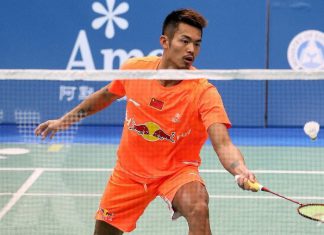 Lin Dan hits a return against Tuan Duc Do during their men's singles first round match at the Badminton Asia Championships in Taipei.