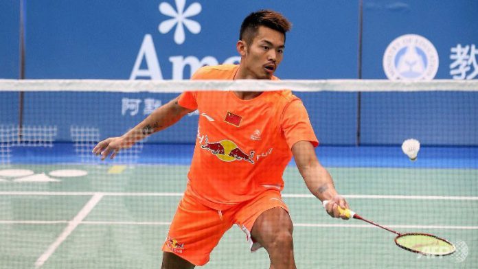 Lin Dan hits a return against Tuan Duc Do during their men's singles first round match at the Badminton Asia Championships in Taipei.