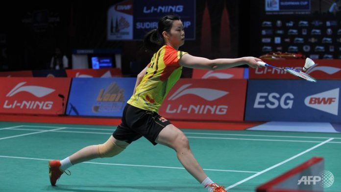 China's Li Xuerui hits a return against Indonesia's Lindaweni Fanetri