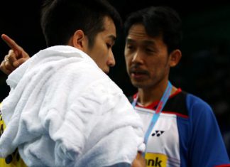 Malaysia's Chong Wei Feng receiving some words of advice from national singles chief coach Rashid Sidek (right) during his first round match against England's Rajiv Ouseph.