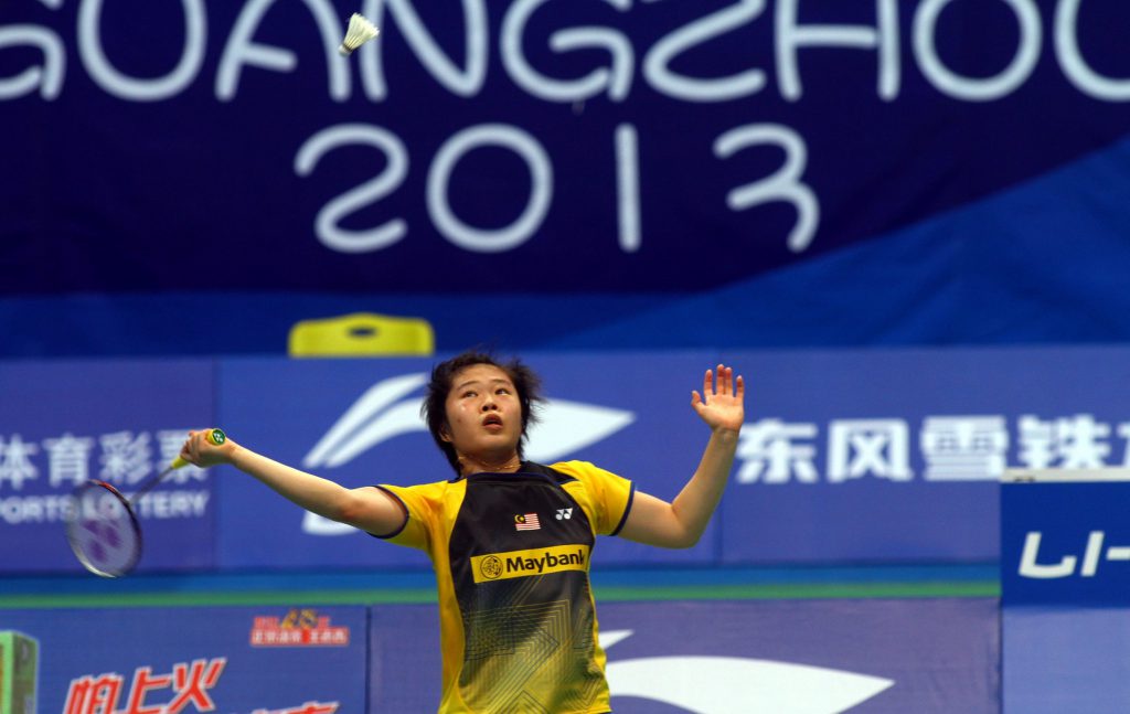 Tee Jing Yi returning the shuttle to Japan's Sayaka Takahashi.