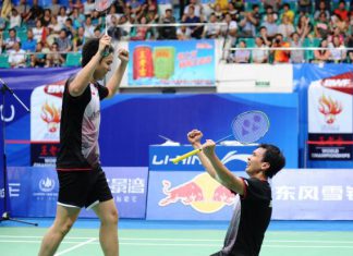 Mohd Ahsan and Hendra Setiawan (left) celebrate after winning the men's doubles final at World Badminton Championships in Guangzhou.