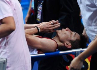 Lee Chong Wei is stretchered away during his World Badminton Championships final against Lin Dan in Guangzhou on August 11, 2013. Lin's win was overshadowed by the failure of the air conditioning mid-match, fuelling conspiracy theories and possibly contributing to Lee's withdrawal on a stretcher with cramp.