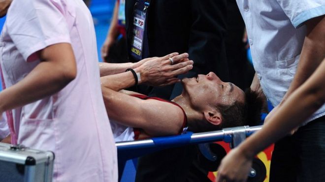 Lee Chong Wei is stretchered away during his World Badminton Championships final against Lin Dan in Guangzhou on August 11, 2013. Lin's win was overshadowed by the failure of the air conditioning mid-match, fuelling conspiracy theories and possibly contributing to Lee's withdrawal on a stretcher with cramp. Lee Chong Wei is stretchered away during his World Badminton Championships final against Lin Dan in Guangzhou on August 11, 2013. Lin's win was overshadowed by the failure of the air conditioning mid-match, fuelling conspiracy theories and possibly contributing to Lee's withdrawal on a stretcher with cramp.